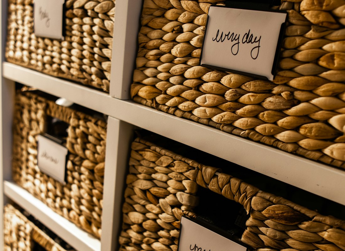 Close-up of labelled drawer organiser dividers in a cabinet